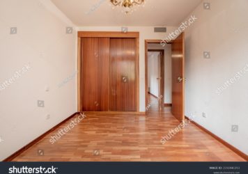 https://flooringjunction.com.au/wp-content/uploads/2022/10/stock-photo-empty-bedroom-with-built-in-wardrobe-with-sliding-wooden-doors-french-oak-parquet-floors-and-2192441253-356x250.jpg