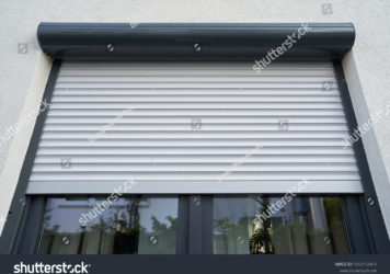 https://flooringjunction.com.au/wp-content/uploads/2022/10/stock-photo-light-roller-shutter-curtains-mounted-on-a-dark-window-1560152414-356x250.jpg
