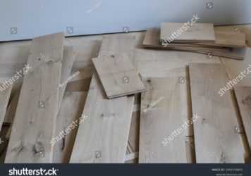 https://flooringjunction.com.au/wp-content/uploads/2022/11/stock-photo-solid-wood-floor-planks-near-a-piece-of-drywall-2041936850-356x250.jpg